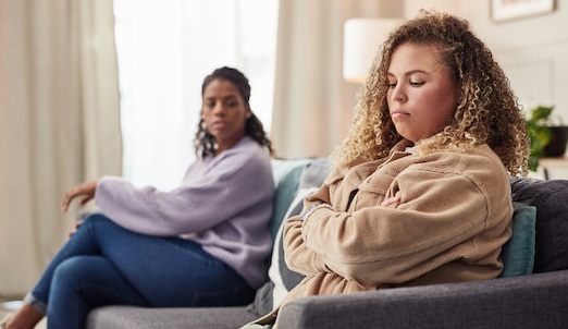 Same-sex couple discussing retirement asset division during divorce consultation